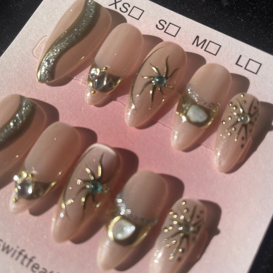 Champagne Glow Long Almond Press-On Nails with Gold Starburst Accents