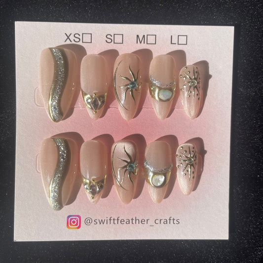 Champagne Glow Long Almond Press-On Nails with Gold Starburst Accents